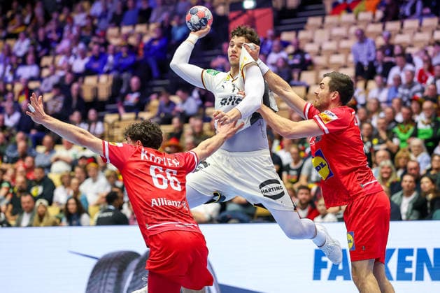 15 01 2026, Handball, Men s EHF EURO 2026, Germany Austria, Jyske Bank Boxing in Herning, Denmark, Preliminary Round Marko Grgic Germany 71 in a duel against Elias Kofler Austria 66 Clem Boris Zivkovic Austria 30 Denmark
