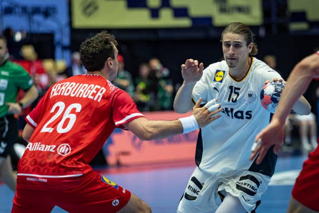 HERNING, DENMARK - JANUARY 15: Juri Knorr (Germany, 15) against Lukas Herburger (Austria, 26) during the EHF EURO 2026 match between Germany vs Austria at Jyske Bank Boxen Arena on matchday 1 of the Group Matches Group A on January 15, 2026 in Herning, Denmark. Midtjylland Denmark Copyright: xMarioxM.xKobergx