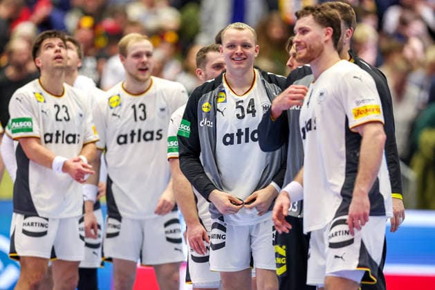 15 01 2026, Handball, Men s EHF EURO 2026, Germany Austria, Jyske Bank Boxing in Herning, Denmark, Preliminary Round Justus Fischer Germany 54 smiling happily next to Renars Uscins Germany 23 Matthes Langhoff Germany 13 Johannes Golla Germany 04 Denmark