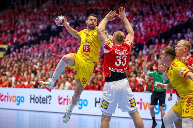 16 01 2026, Handball, Men s EHF EURO 2026, Denmark North Macedonia, Jyske Bank Boxing in Herning, Denmark, Preliminary Round Filip Kuzmanovski North Macedonia 18 in duel against Emil Siersbaek Bergholt Denmark 33 Denmark