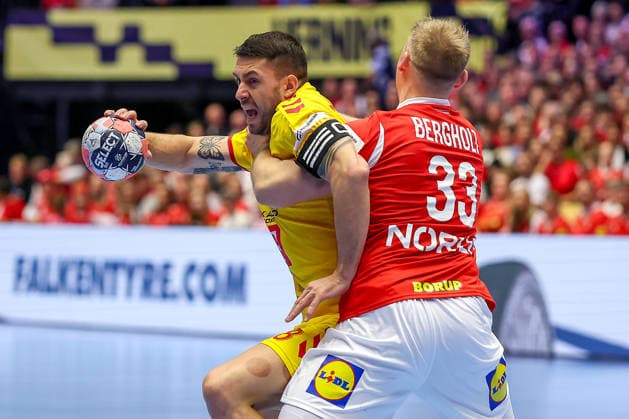 16 01 2026, Handball, Men s EHF EURO 2026, Denmark North Macedonia, Jyske Bank Boxing in Herning, Denmark, Preliminary Round Filip Kuzmanovski North Macedonia 18 in duel against Emil Siersbaek Bergholt Denmark 33 Denmark