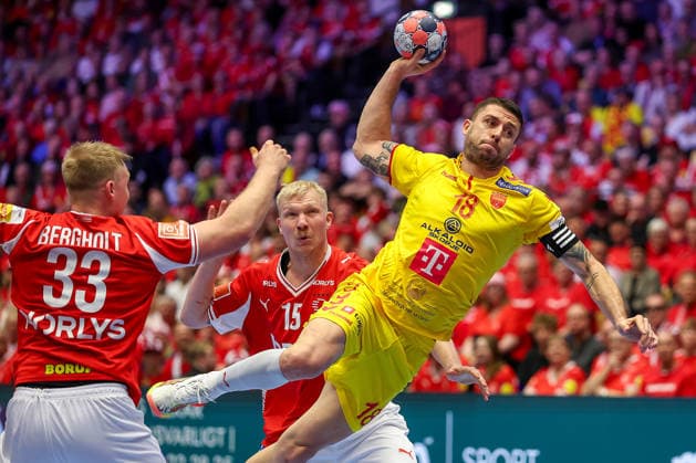 16 01 2026, Handball, Men s EHF EURO 2026, Denmark North Macedonia, Jyske Bank Boxen in Herning, Denmark, Preliminary Round Filip Kuzmanovski North Macedonia 18 vs Emil Siersbaek Bergholt Denmark 33 and Magnus Saugstrup Jensen Denmark 15 Denmark