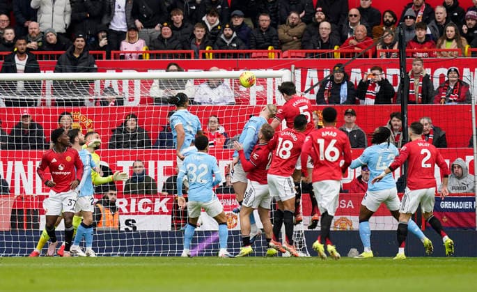 Manchester, England, 17th January 2026. Harry Maguire of Manchester United, ManU heads against the bar during the Manchester United vs Manchester City Premier League match at Old Trafford, Manchester. Picture credit should read: Andrew Yates Sportimage EDITORIAL USE ONLY. No use with unauthorised audio, video, data, fixture lists, club league logos or live services. Online in-match use limited to 120 images, no video emulation. No use in betting, games or single club league player publications. SPI_040_AY_ManUtd_ManCity SPI-4456-0039