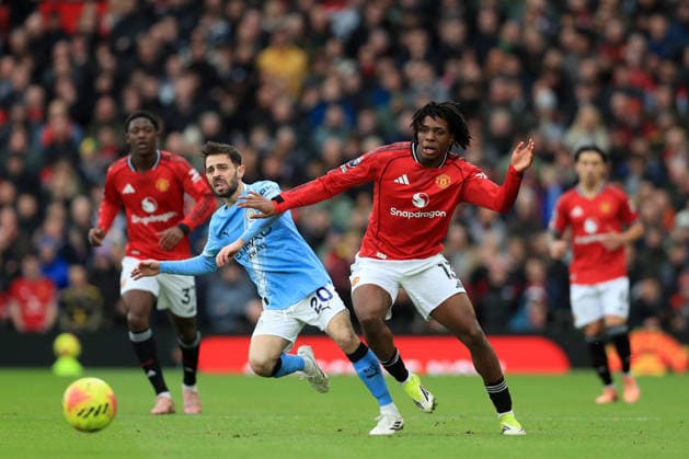 17th January 2026; Old Trafford, Manchester, England; Premier League Football, Manchester United, ManU versus Manchester City; Phil Foden of Manchester City competes for the ball with Patrick Dorgu of Manchester United  DavidxBlunsden