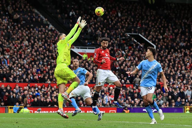 17th January 2026; Old Trafford, Manchester, England; Premier League Football, Manchester United, ManU versus Manchester City; Gianluigi Donnarumma of Manchester City claims a cross under pressure from Bruno Fernandes of Manchester United  DavidxBlunsden