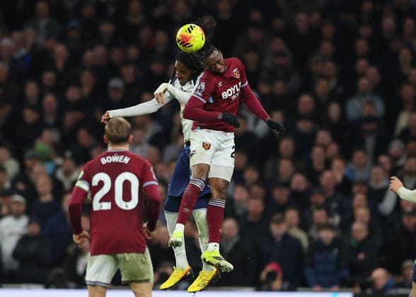17th January 2026; Tottenham Hotspur Stadium, London, England; Premier League Football, Tottenham Hotspur versus West Ham United; Aaron Wan-Bissaka of West Ham United heads the ball over Djed Spence of Tottenham Hotspur  JohnxPatrickxFletcher