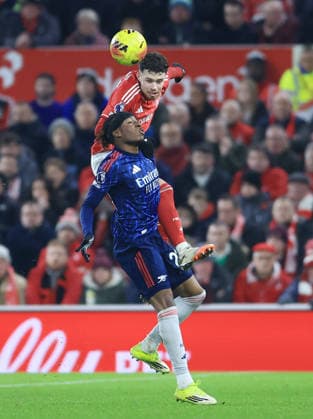 Nottingham, England, 17th January 2026. Neco Williams of Nottingham Forest and Noni Madueke of Arsenal during the Nottingham Forest vs Arsenal Premier League match at the City Ground, Nottingham. Picture credit should read: Jessica Hornby Sportimage EDITORIAL USE ONLY. No use with unauthorised audio, video, data, fixture lists, club league logos or live services. Online in-match use limited to 120 images, no video emulation. No use in betting, games or single club league player publications. SPI_042_JH_FOREST_ARSENAL SPI-4459-0040