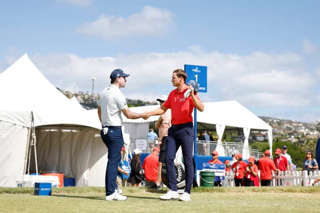 January 17, 2026, Honolulu, Hawaii, USA: NICK TAYLOR, left, shakes ADRIEN DUMONT DE CHASSARTÃ¢â‚¬â ¢s hand, right at the 1st during Round 3 of the 2026 Sony Open in Honolulu, Hawaii on January 17, 2026. Honolulu USA - ZUMAm310 20260117_zsp_m310_121 Copyright: xElliotxMilesx