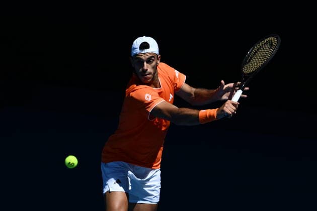 TENNIS AUSTRALIAN OPEN, Francisco Cerundolo of Argentina returns during the Men™s 1st round match against Zhizhen Zhang of China on day 1 of the 2026 Australian Open tennis tournament at Melbourne Park in Melbourne, Sunday, January 18, 2026. ( NO ARCHIVING MELBOURNE VICTORIA AUSTRALIA  Copyright: xJOELxCARRETTx 20260118157555539274
