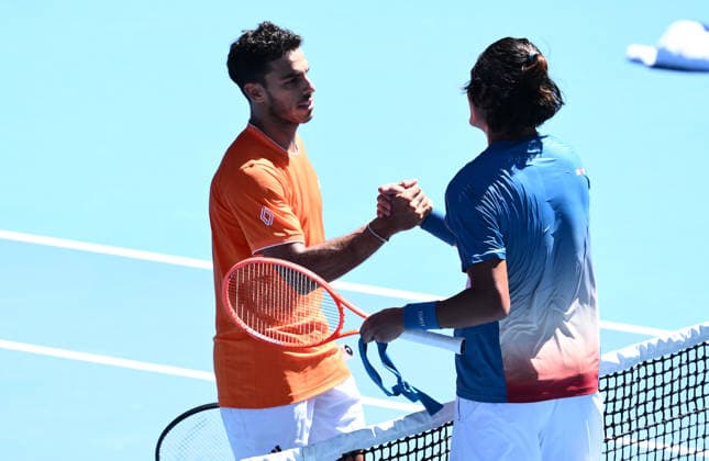 TENNIS AUSTRALIAN OPEN, Francisco Cerundolo of Argentina (l) shakes hands with Zhizhen Zhang of China after winning his Men™s 1st round match on day 1 of the 2026 Australian Open tennis tournament at Melbourne Park in Melbourne, Sunday, January 18, 2026. ( NO ARCHIVING MELBOURNE VICTORIA AUSTRALIA  Copyright: xJOELxCARRETTx 20260118148484499178