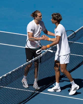 (260118) -- MELBOURNE, Jan. 18, 2026 -- Alexander Zverev (L) and Gabriel Diallo shake hands after the men s singles 1st round match between Alexander Zverev of Germany and Gabriel Diallo of Canada at the Australian Open tennis tournament in Melbourne, Australia, Jan. 18, 2026. (Photo by Xinhua) (SP)AUSTRALIA-MELBOURNE-TENNIS-AUSTRALIAN OPEN-MEN S SINGLES-DAY 1 HuxJingchen 