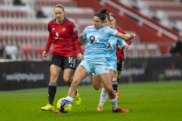 18th January 2026; Leigh Sports Village, Manchester, England; Womens FA Cup Football, Manchester United, ManU versus Burnley; Lisa Naalsund of Manchester United Women is tackled by Brenna McPartlan of Burnley Women  TimxWilliams Content restricted for UK based newspaper