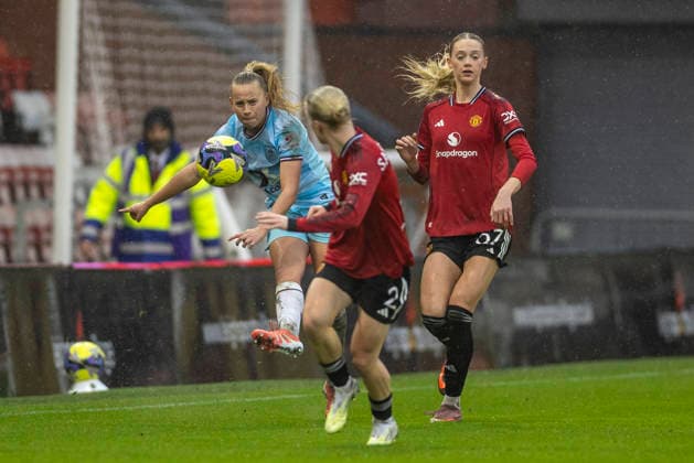 18th January 2026; Leigh Sports Village, Manchester, England; Womens FA Cup Football, Manchester United, ManU versus Burnley; Emma Siddall of Burnley Women clears the ball past Anna Sandberg of Manchester United Women  TimxWilliams Content restricted for UK based newspaper