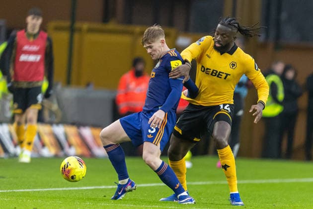 Wolverhampton Wanderers v Newcastle United, Premier League Newcastle United defender Lewis Hall (3) battles for possession with Wolverhampton Wanderers forward Tolu Arokodare (14) during the Premier League match between Wolverhampton Wanderers and Newcastle United at Molineux, Wolverhampton, UK on 18 January 2026. Wolverhampton Molineux West Midlands UK Editorial use only DataCo restrictions apply See www.football-dataco.com , Copyright: xManjitxNarotrax PSI-23598-0043