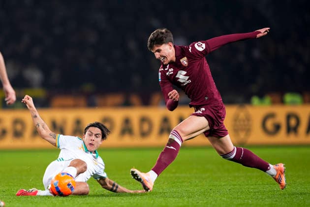 RomaÕs Paulo Dybala fights for the ball with TorinoÕs Cesare Casadei during the Serie A soccer match between Torino Fc and Roma at the Stadio Olimpico Grande Torino in Turin, north west Italy - January 18, 2026. - Soccer  Copyright: xFabioxFerrari LaPressex
