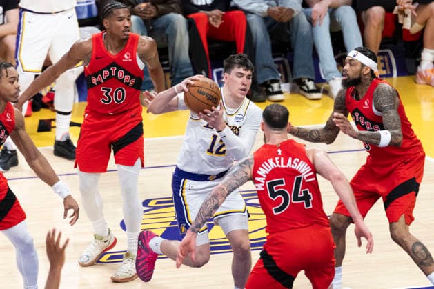 January 18, 2026, Los Angeles, California, USA: Los Angeles LakersÃ¢â‚¬â ¢ Jake LaRavia (12) drives against the Toronto Raptors during an NBA, Basketball Herren, USA basketball game at Crypto.com Arena on Sunday, Jan. 18, 2026 in Los Angeles. Los Angeles USA - ZUMAc68_ 20260118_zaf_c68_050 Copyright: xRingoxChiux
