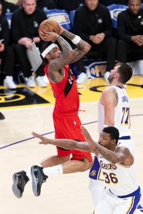 January 18, 2026, Los Angeles, California, USA: Toronto Raptors Brandon Ingram (3) shoots against Los Angeles LakersÃ¢â‚¬â ¢ Luka DonÄÂiÄ¡ (77) during an NBA, Basketball Herren, USA basketball game at Crypto.com Arena on Sunday, Jan. 18, 2026 in Los Angeles. Los Angeles USA - ZUMAc68_ 20260118_zaf_c68_055 Copyright: xRingoxChiux