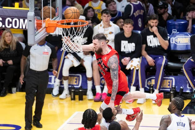 January 18, 2026, Los Angeles, California, USA: Toronto Raptors Sandro Mamukelashvili (54) goes to the basket against Los Angeles LakersÃ¢â‚¬â ¢ Marcus Smart (36) during an NBA, Basketball Herren, USA basketball game at Crypto.com Arena on Sunday, Jan. 18, 2026 in Los Angeles. Los Angeles USA - ZUMAc68_ 20260118_zaf_c68_068 Copyright: xRingoxChiux