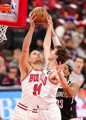 (260119) -- CHICAGO, Jan. 19, 2026 -- Chicago Bulls Nikola Vucevic (L) and Matas Buzelis (C) compete during the 2025-2026 NBA, Basketball Herren, USA regular season basketball game between Brooklyn Nets and Chicago Bulls at United Center in Chicago, the United States, Jan. 18, 2026. (Photo by Xinhua) (SP)U.S.-CHICAGO-BASKETBALL-NBA-NETS VS BULLS JoelxLerner 