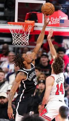 (260119) -- CHICAGO, Jan. 19, 2026 -- Brooklyn Nets Nic Claxton (L) blocks the shot of Chicago Bulls Matas Buzelis during the 2025-2026 NBA, Basketball Herren, USA regular season basketball game between Brooklyn Nets and Chicago Bulls at United Center in Chicago, the United States, Jan. 18, 2026. (Photo by Xinhua) (SP)U.S.-CHICAGO-BASKETBALL-NBA-NETS VS BULLS JoelxLerner 