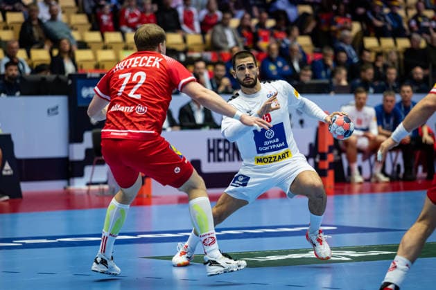 HERNING, DENMARK - JANUARY 19: Uros Kojadinovic (Serbia, 15) against Lukas Hutecek (Austria, 72) during the EHF EURO 2026 match between Austria vs Serbia at Jyske Bank Boxen Arena on matchday 3 of the Group Matches Group A on January 19, 2026 in Herning, Denmark. Midtjylland Denmark Copyright: xMarioxM.xKobergx
