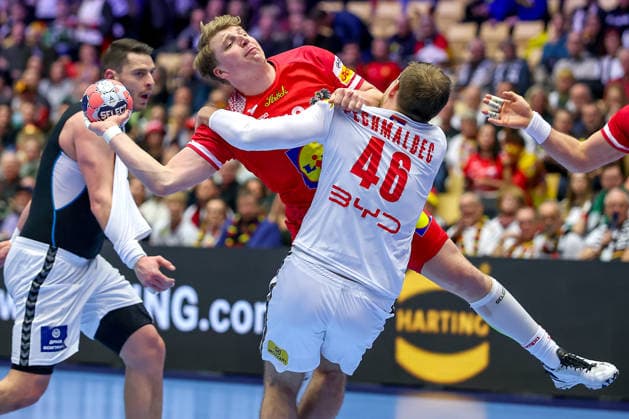 19 01 2026, Handball, Men s EHF EURO 2026, Austria Serbia, Jyske Bank Boxing in Herning, Denmark, Preliminary Round Lukas Hutecek Austria 72 in a duel against Dragan Pechmalbec Serbia 46 Denmark