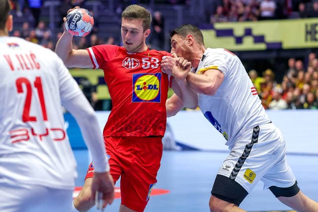 19 01 2026, Handball, Men s EHF EURO 2026, Austria Serbia, Jyske Bank Boxing in Herning, Denmark, Preliminary Round Mykola Bilyk Austria 53 in a duel against Mijajlo Marsenic Serbia 93 Denmark