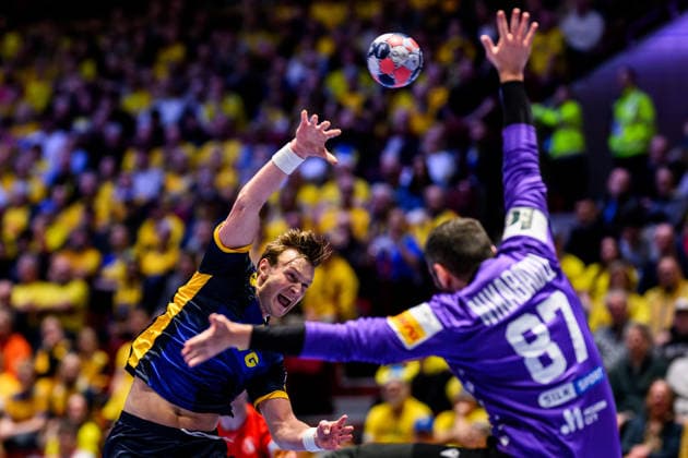 260119 Jonathan Carlsbogard of Sweden and goalkeeper David Nikabadze of Georgia during the EHF European Handball Championship preliminary round match between Georgia and Sweden on January 19, 2026 in Malmö Photo Petter Arvidson BILDBYRAN kod PA PA1125 handball handball handball handballs em 2026 georgia sverige sweden ehf european handball championship georgia bbeng  Copyright: PETTERxARVIDSON BB260119PA129