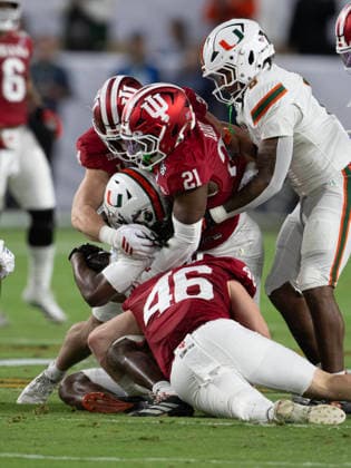 January 19, 2026, Miami, Florida, USA: Miami player 4 RB MARK FLETCHER JR. getting stopped by the Indiana secondary 46 LB ISAIAH JONES and 21 LB ROLIJAH HARDY stopping the play. Miami USA - ZUMAm147 20260119_zap_m147_015 Copyright: xHossxMcBainx