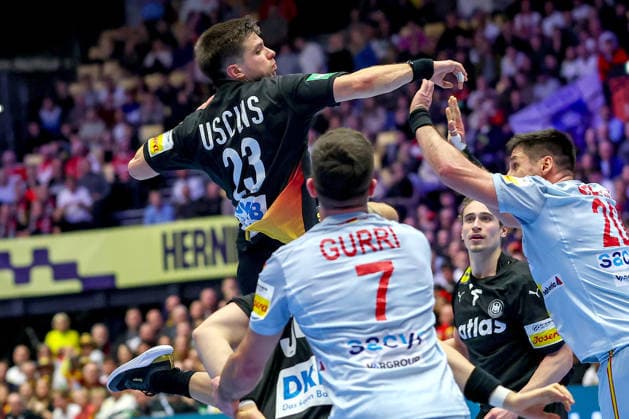 19 01 2026, Handball, Men s EHF EURO 2026, Germany Spain, Jyske Bank Boxing in Herning, Denmark, Preliminary Round Renars Uscins Germany 23 asserts himself against Jan Gurri Aregay Espania 07 Abel Serdio Guntin Espania 20 Denmark