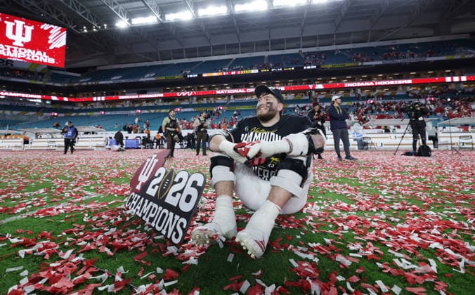 Indiana offensive lineman Zen Michalski (75) sits on the field after the Hoosiers defeated the Miami Hurricanes 27-21 in the NCAA, College League, USA College Football Championship game at Hard Rock Stadium in Miami, Florida, on Monday, January 19, 2026.  MIA20260119892 AARONxJOSEFCZYK