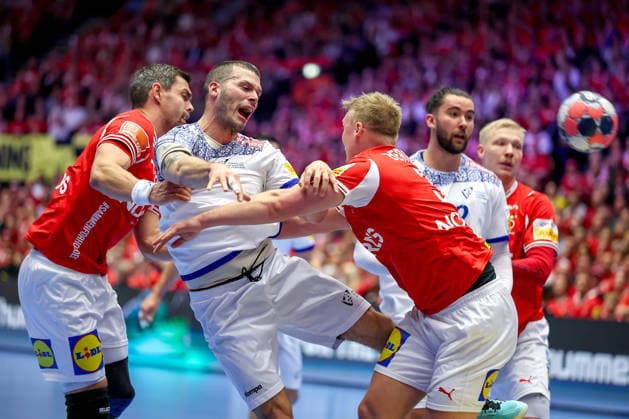 20 01 2026, Handball, Men s EHF EURO 2026, Denmark Portugal, Jyske Bank Boxing in Herning, Denmark, Preliminary Round Rui Sousa Martins Silva Portugal 14 in a duel against Rasmus Lauge Schmidt Denmark 11 Emil Siersbaek Bergholt Denmark 33 Denmark