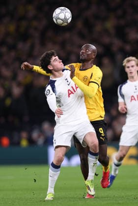 London, England, 20th January 2026. Archie Gray of Tottenham tussles with Servo Guirassy of Borussia Dortmund during the Tottenham Hotspur vs Borussia Dortmund UEFA Champions League match at the Tottenham Hotspur Stadium, London. Picture credit should read: David Klein Sportimage EDITORIAL USE ONLY. No use with unauthorised audio, video, data, fixture lists, club league logos or live services. Online in-match use limited to 120 images, no video emulation. No use in betting, games or single club league player publications. SPI_061_DK_Spurs_Dortmund SPI-4464-0061