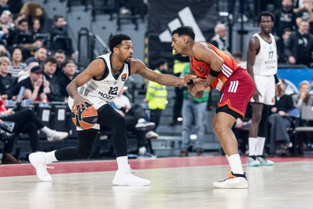 MUNICH, GERMANY - JANUARY 20: Sterling Brown (Partizan Mozzart Bet Belgrade, 12) controls the ball against Xavier Rathan-Mayes (FC Bayern Muenchen, 4) during the Turkish Airlines EuroLeague match between FC Bayern Muenchen vs. Partizan Mozzart Bet Belgrade at SAP Garden on round 23 of Turkish Airlines EuroLeague on January 20, 2026 in Munich, Germany. Bavaria Germany Copyright: xSteffiexWunderlx