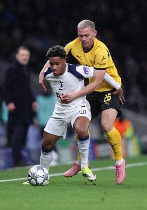 London, England, 20th January 2026. Wilson Odobert of Tottenham holds up Julian Ryerson of Borussia Dortmund during the Tottenham Hotspur vs Borussia Dortmund UEFA Champions League match at the Tottenham Hotspur Stadium, London. Picture credit should read: David Klein Sportimage EDITORIAL USE ONLY. No use with unauthorised audio, video, data, fixture lists, club league logos or live services. Online in-match use limited to 120 images, no video emulation. No use in betting, games or single club league player publications. SPI_081_DK_Spurs_Dortmund SPI-4464-0082