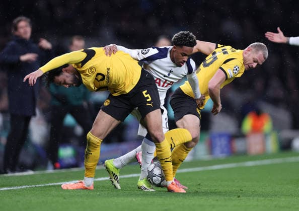 London, England, 20th January 2026. Wilson Odobert of Tottenham (c) gets between Ramy Bensebaini of Borussia Dortmund (l) and Julian Ryerson of Borussia Dortmund (r) during the Tottenham Hotspur vs Borussia Dortmund UEFA Champions League match at the Tottenham Hotspur Stadium, London. Picture credit should read: David Klein Sportimage EDITORIAL USE ONLY. No use with unauthorised audio, video, data, fixture lists, club league logos or live services. Online in-match use limited to 120 images, no video emulation. No use in betting, games or single club league player publications. SPI_083_DK_Spurs_Dortmund SPI-4464-0083