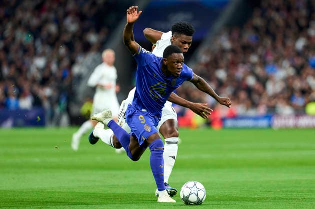 Folarin Balogun of AS Monaco FC battles for the ball with Aurelien Tchouameni of Real Madrid CF during the UEFA Champions League match between Real Madrid CF and AS Monaco FC at Bernabeu stadium on January 20, 2026. - 20 01 2026 - Spain Madrid Madrid -  LGMx xLexPictorium LePictorium_0323254