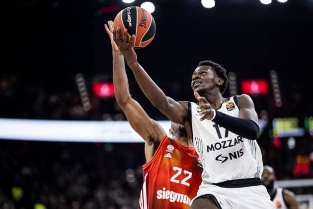 MUNICH, GERMANY - JANUARY 20: Isaac Bonga (Partizan Mozzart Bet Belgrade, 17) controls the ball against Isiaha Mike (FC Bayern Muenchen, 22) during the Turkish Airlines EuroLeague match between FC Bayern Muenchen vs. Partizan Mozzart Bet Belgrade at SAP Garden on round 23 of Turkish Airlines EuroLeague on January 20, 2026 in Munich, Germany. Bavaria Germany Copyright: xSteffiexWunderlx
