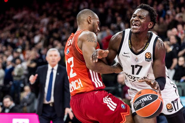 MUNICH, GERMANY - JANUARY 20: Isaac Bonga (Partizan Mozzart Bet Belgrade, 17) controls the ball against Isiaha Mike (FC Bayern Muenchen, 22) during the Turkish Airlines EuroLeague match between FC Bayern Muenchen vs. Partizan Mozzart Bet Belgrade at SAP Garden on round 23 of Turkish Airlines EuroLeague on January 20, 2026 in Munich, Germany. Bavaria Germany Copyright: xSteffiexWunderlx