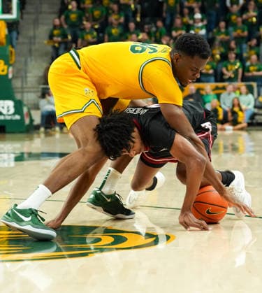 January 20, 2026, Waco, Texas, USA: Baylor center JAMES NNAJI (46) battles Texas Tech guard CHRISTIAN ANDERSON (4) for a loose ball during a college basketball game between the Baylor Bears and the Texas Tech Red Raiders on January 20, 2026 in Waco, Texas. Texas Tech won, 92-73. Waco USA - ZUMAc201 20260120_zap_c201_072 Copyright: xScottxColemanx
