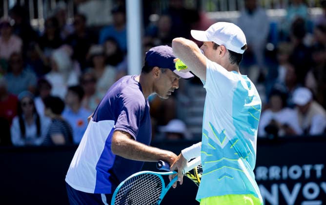 (260121) -- MELBOURNE, Jan. 21, 2026 -- Rajeev Ram (L) of the United States Matthew Ebden of Australia react during the men s doubles 1st round match against Zhang Zhizhen Shang Juncheng of China at the Australian Open tennis tournament in Melbourne, Australia, Jan. 21, 2026. (Photo by Xinhua) (SP)AUSTRALIA-MELBOURNE-TENNIS-AUSTRALIAN OPEN-MEN S DOUBLES-DAY 4 HuxJingchen 