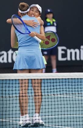 (260121) -- MELBOURNE, Jan. 21, 2026 -- Zhang Shuai (rear) hugs with Elise Mertens after the women s doubles 1st round match between Zhang Shuai (China) Elise Mertens (Belgium) and Sorana Cirstea (Romania) Anna Kalinskaya (Russia) at the Australian Open tennis tournament in Melbourne, Australia, Jan. 21, 2026. (Photo by Xinhua) (SP)AUSTRALIA-MELBOURNE-TENNIS-AUSTRALIAN OPEN-WOMEN S DOUBLES-DAY 4 WangxShen 
