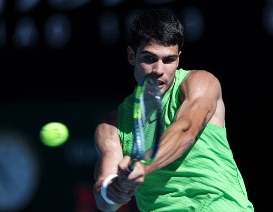 (260121) -- MELBOURNE, Jan. 21, 2026 -- Carlos Alcaraz of Spain hits a return during the men s singles 2nd round match against Yannick Hanfmann of Germany at the Australian Open tennis tournament in Melbourne, Australia, Jan. 21, 2026. ) (SP)AUSTRALIA-MELBOURNE-TENNIS-AUSTRALIAN OPEN-MEN S SINGLES-DAY 4 MaxPing 