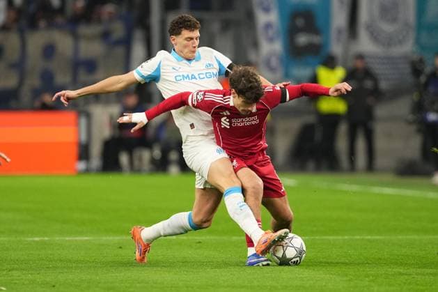 Milos Kerkez of Liverpool is tackled by Benjamin Pavard of Marseille Marseille v Liverpool, UEFA Champions League, Group Stage, Football, Orange Velodrome, Marseille, France - 21 Jan 2026Marseille Orange Vélodrome France EDITORIAL USE ONLY No use with unauthorised audio, video, data, fixture lists, club league logos or live services. Online in-match use limited to 120 images, no video emulation. No use in betting, games or single club league player publications. Copyright: xDavexWinter Shutterstockx 16348361al