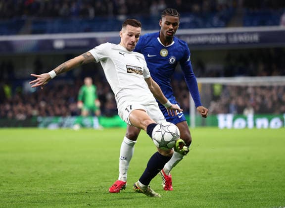 London, England, 21st January 2026. Mislav Orsic of Pafos FC (L) is challenged by Jorrel Hato of Chelsea during the Chelsea vs Pafos FC UEFA Champions League match at Stamford Bridge, London. Picture credit should read: David Klein Sportimage EDITORIAL USE ONLY. No use with unauthorised audio, video, data, fixture lists, club league logos or live services. Online in-match use limited to 120 images, no video emulation. No use in betting, games or single club league player publications. SPI_010_DK_CHELSEA_PAFOS SPI-4466-0010