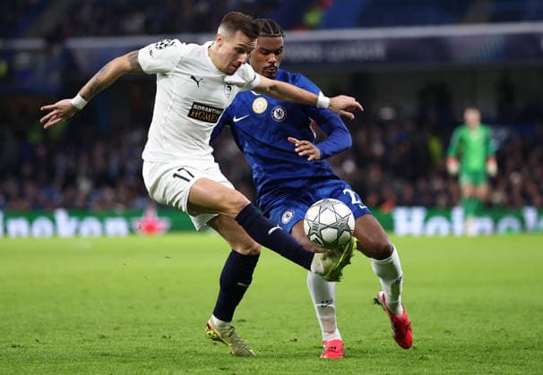 London, England, 21st January 2026. Mislav Orsic of Pafos FC (L) is challenged by Jorrel Hato of Chelsea during the Chelsea vs Pafos FC UEFA Champions League match at Stamford Bridge, London. Picture credit should read: David Klein Sportimage EDITORIAL USE ONLY. No use with unauthorised audio, video, data, fixture lists, club league logos or live services. Online in-match use limited to 120 images, no video emulation. No use in betting, games or single club league player publications. SPI_011_DK_CHELSEA_PAFOS SPI-4466-0011