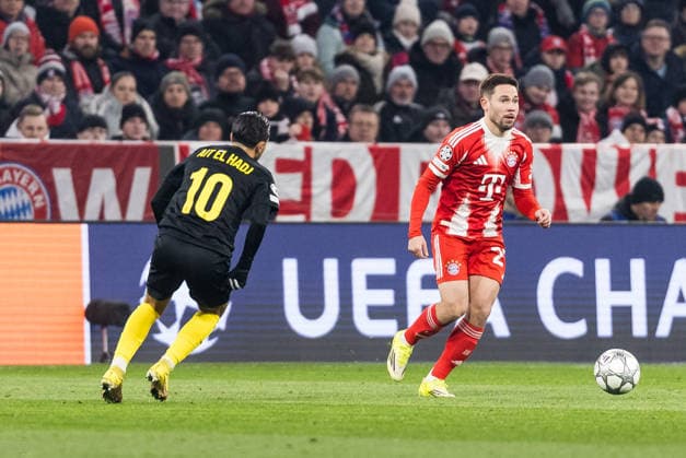 MUNICH, GERMANY - JANUARY 21: Raphael Guerreiro (FC Bayern Muenchen, 22) controls the ball against Anouar Ait El Hadj (Royale Union Saint-Gilloise, 10) during the UEFA Champions League match between FC Bayern Munich vs. Royale Union Saint-Gilloise at Allianz Arena on matchday 7 of the UEFA Champions League Season 2025 26 on January 21, 2025 in Munich, Germany. Bavaria Germany Copyright: xSteffiexWunderlx