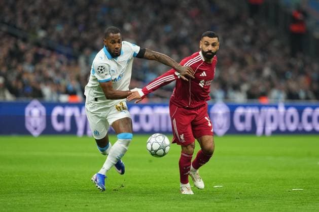 Mohamed Salah of Liverpool battles with Michael Murillo of Marseille Marseille v Liverpool, UEFA Champions League, Group Stage, Football, Orange Velodrome, Marseille, France - 21 Jan 2026Marseille Orange Vélodrome France EDITORIAL USE ONLY No use with unauthorised audio, video, data, fixture lists, club league logos or live services. Online in-match use limited to 120 images, no video emulation. No use in betting, games or single club league player publications. Copyright: xDavexWinter Shutterstockx 16348361bi