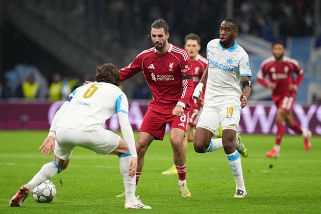 Dominik Szoboszlai of Liverpool takes on Leonardo Balerdi of Marseille Marseille v Liverpool, UEFA Champions League, Group Stage, Football, Orange Velodrome, Marseille, France - 21 Jan 2026Marseille Orange Vélodrome France EDITORIAL USE ONLY No use with unauthorised audio, video, data, fixture lists, club league logos or live services. Online in-match use limited to 120 images, no video emulation. No use in betting, games or single club league player publications. Copyright: xDavexWinter Shutterstockx 16348361bw