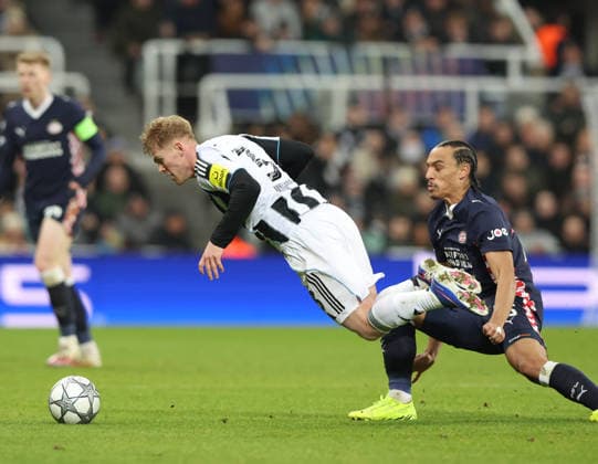 Newcastle Upon Tyne, England, 21st January 2026. Lewis Hall of Newcastle United fouled by Kiliann Sildillia of PSV Eindhoven during the Newcastle United vs PSV Eindhoven UEFA Champions League match at St. James Park, Newcastle Upon Tyne. Picture credit should read: Nigel Roddis Sportimage EDITORIAL USE ONLY. No use with unauthorised audio, video, data, fixture lists, club league logos or live services. Online in-match use limited to 120 images, no video emulation. No use in betting, games or single club league player publications. SPI_034_NR_NEWC_PSV SPI-4467-0032